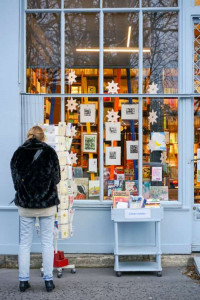 man-looks-at-local-greeting-cards-Christmas-shopping-photo-by-megan-bucknall-unsplash